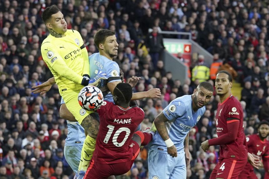 Manchester City's goalkeeper Ederson (left) in action against Liverpool's Sadio Mane, on Oct 3, 2021