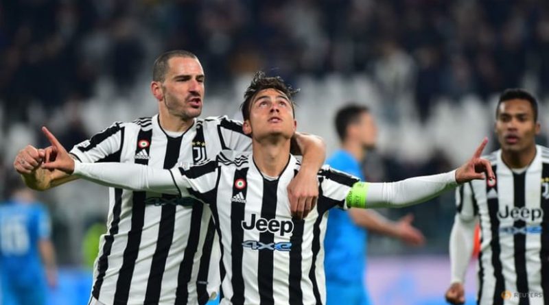 Juventus' Paulo Dybala celebrates scoring their second goal with Leonardo Bonucci.