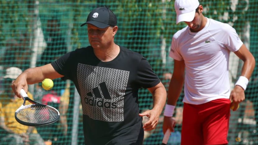 FILE PHOTO: Novak Djokovic of Serbia and his coach Marian Vajda attend a training session in Belgrade, Serbia, May 2, 2018